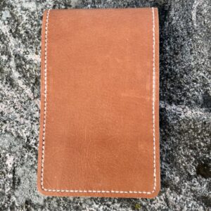 Golf yardage book cover in cognac colored pulled-up genuine leather