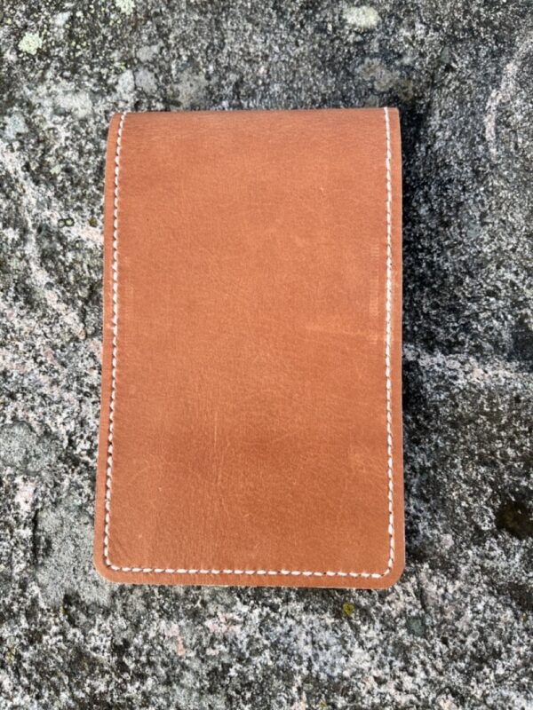 Golf yardage book cover in cognac colored pulled-up genuine leather